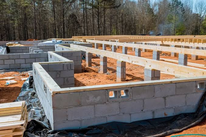 Foundation repair by Bats Foundation Repair, LLC in Mueller — perimeter excavation and pier bracket installation